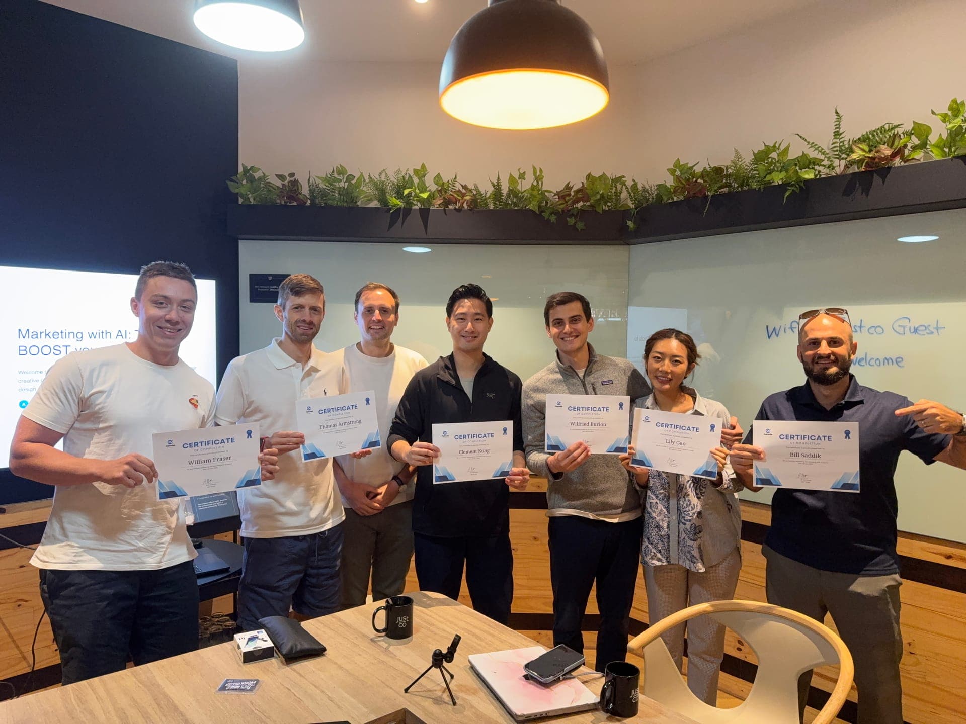 Pathwise Academy adult graduates holding their completion certificates