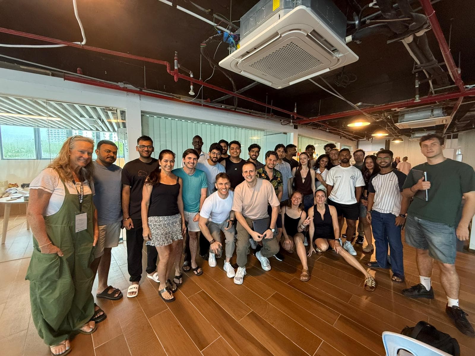 Pathwise Academy adult cohort posed together after a workshop in Singapore